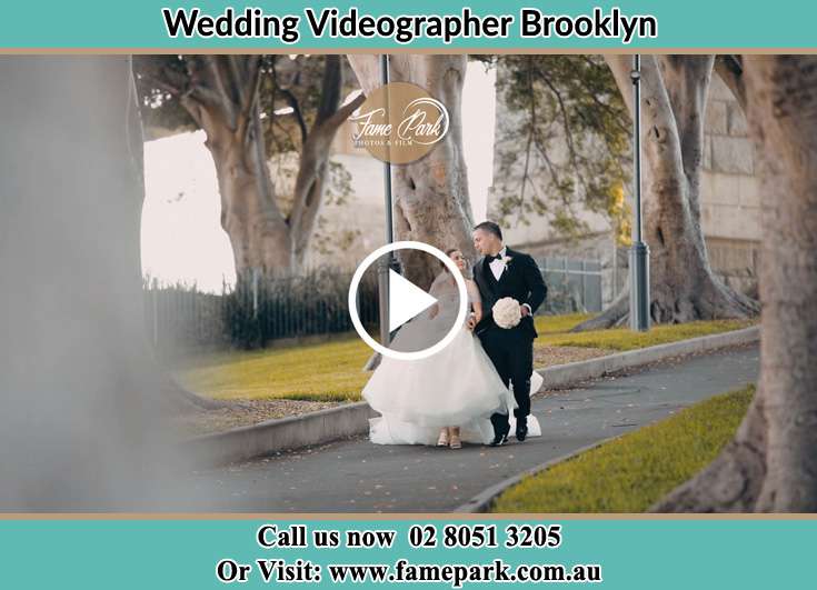 Bride and Groom looking at each other while walking in the park Brooklyn NSW 2083