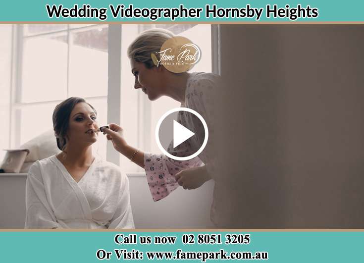 A girl applying makeup to the Bride Hornsby Heights NSW 2077